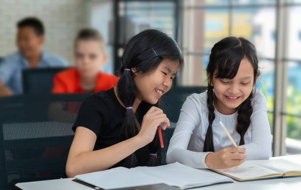 istock Asian students have fun writing on the notebook in classroom 1134846226
