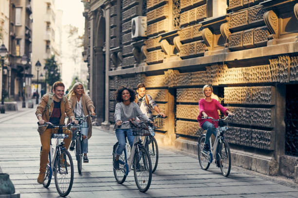 istock Friends Riding Bicycles In A City 1134846963