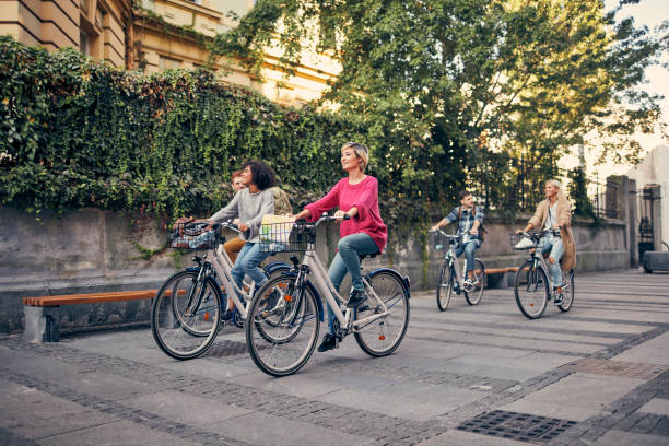istock Friends Riding Bicycles In A City 1134846985