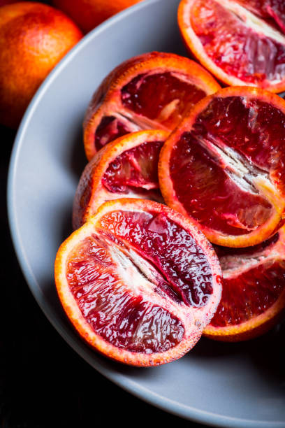 istock Sweet juicy red oranges on the rustic background 1134850035
