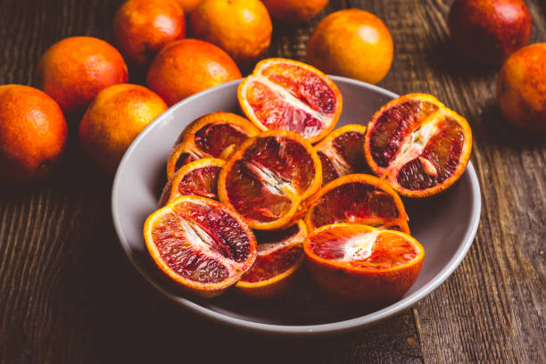 istock Sweet juicy red oranges on the rustic background 1134850043