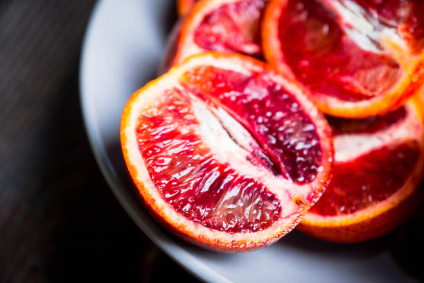 istock Sweet juicy red oranges on the rustic background 1134850046