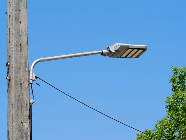 istock LED street lamp post with blue sky cloud 1134850767