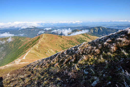 Tatra rosky mountain peaks with tourist hiking trails in sunny summer day. Slovakia