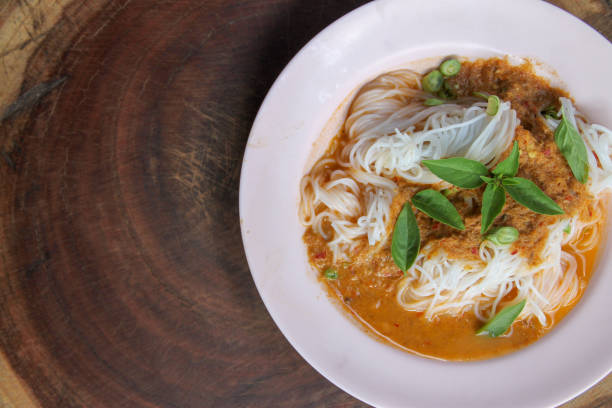 istock Traditional Thai cuisine, rice vermicelli eaten with green curry. 1134854192