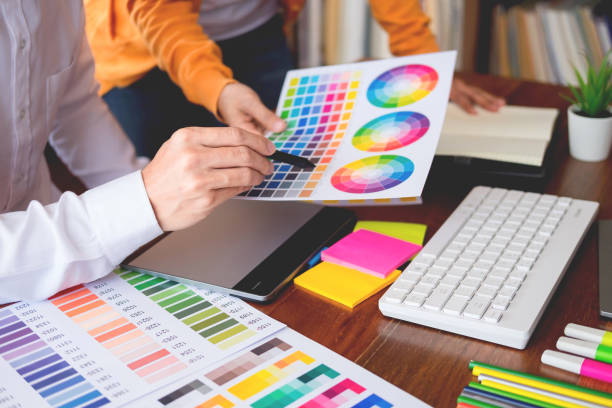 istock Midsection Of Creative Occupation People Working On Color Swatches On Table 1134855327