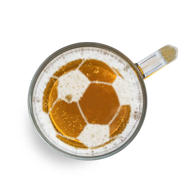 Soccer or football ball sign on the beer foam in glass, isolated on white background. Top view stock photo