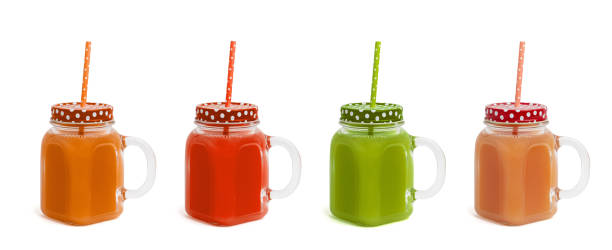 istock Some glasses with different colors juices on a white background. Side view 1134856265