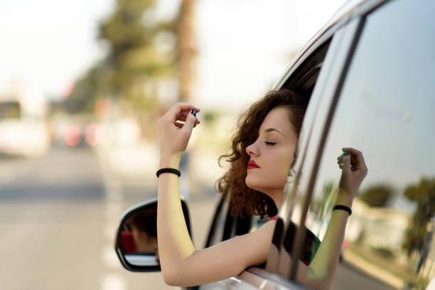 istock beautiful young woman in car 1134860291