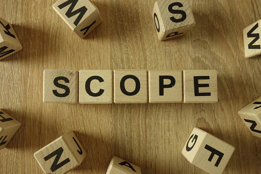 Scope word from wooden blocks on desk
