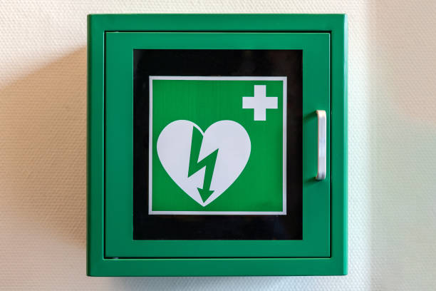 Defibrillator AED in cupboard with green white symbol Automatic Electronic Defribilator defibrillator photos stock pictures, royalty-free photos & images