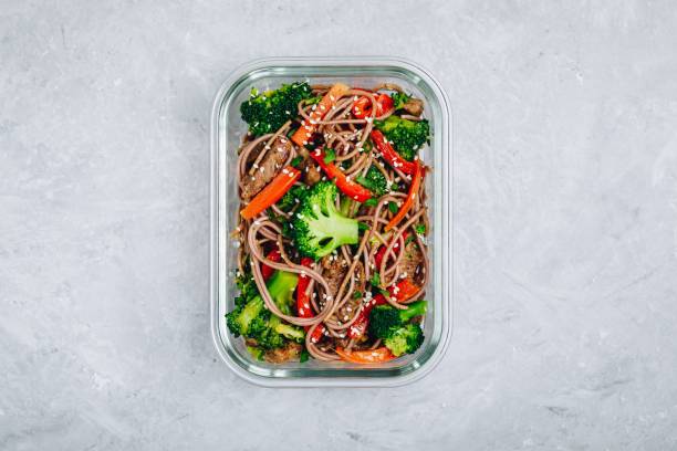 istock Beef broccoli noodles stir fry meal prep lunch box container 1134865748