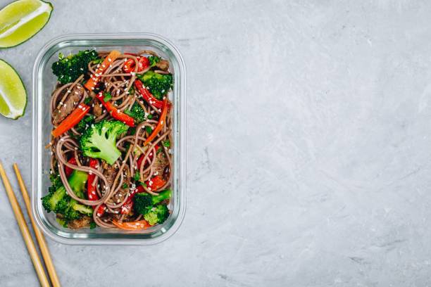 istock Beef broccoli noodles stir fry meal prep lunch box container 1134865829