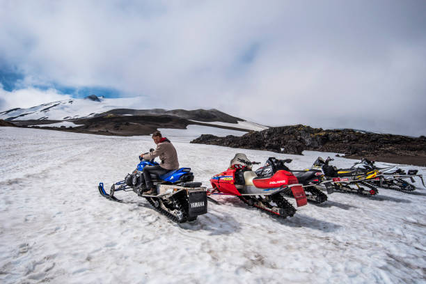 Snowmobile ride activity in Snaefellsjokull National Park in summer time. Snaefellsnes peninsula in Western Iceland. Snaefellsjokull, Iceland - 19 July, 2018.  Snowmobile ride activity in Snaefellsjokull National Park in summer time. Snaefellsnes peninsula in Western Iceland. Snowmobiling stock pictures, royalty-free photos & images