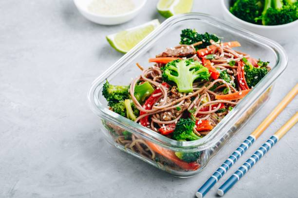 istock Beef broccoli noodles stir fry meal prep lunch box container 1134866304