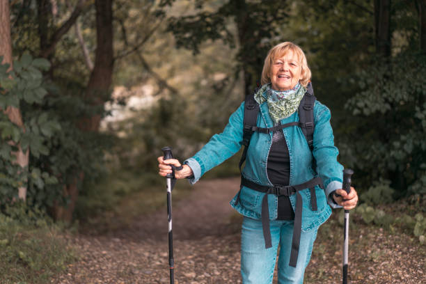 istock Senior woman walking in the park 1134869490