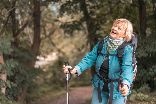 istock Happy senior woman backpacking 1134871363