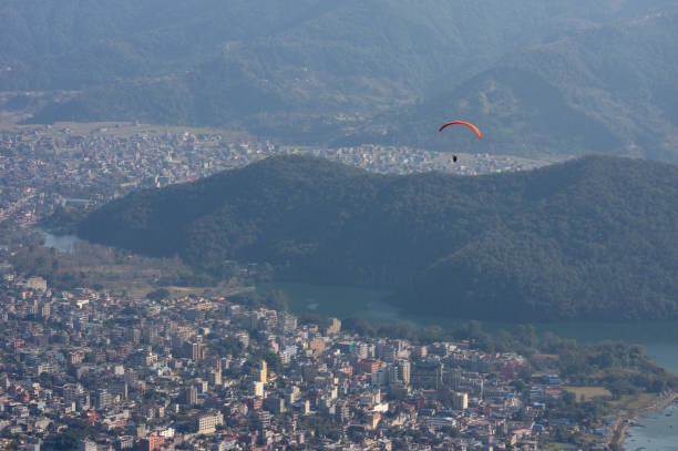 istock Parasailor Floating over a City 1134871628
