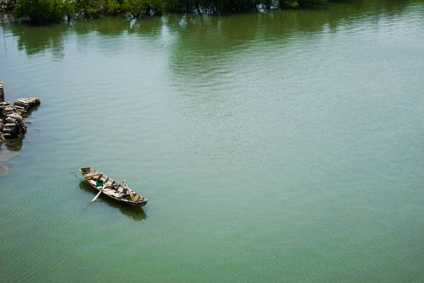 istock Fisher boat on the lake in still water 1134872946
