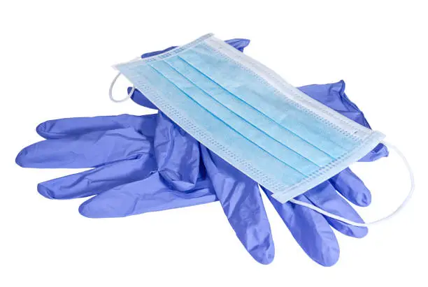 Blue medical mask on the latex gloves on white background. Medical and healthcare. Conception of hygiene, protective and care.