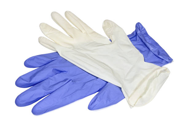 White and blue latex gloves isolated on white background White and light blue latex gloves on white surface. Conception of hygiene, protective and care. surgical glove stock pictures, royalty-free photos & images