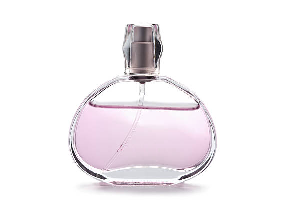 istock transparent bottle of pink perfume isolated 113487319
