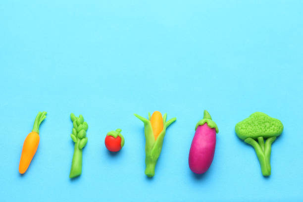 istock Plasticine vegetables for healthy diet. Carrots, asparagus, tomato, corn, eggplant and broccoli. Antioxidants, organic foods 1134874026