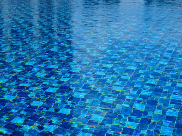 istock Chairs and swimming pool with steel ladder 1134874606