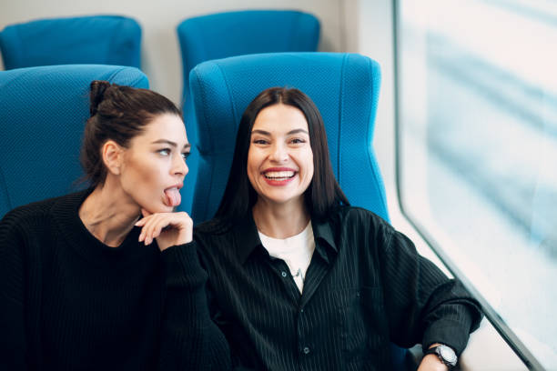 istock Two girlfriends going to trip by railway train.  Women Friendship Concept. 1134876149