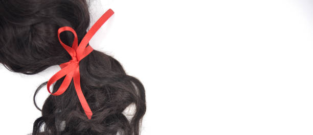 istock Dark curly hair with red lace on the white background 1134877370