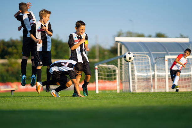 istock professional young 10 years old soccer players having fun during free kick training 1134877498