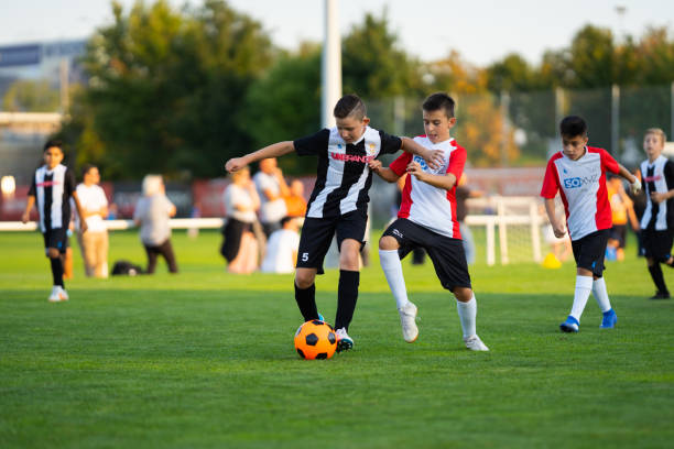istock professional junior soccer training outdoors on football lawn duel 1134877531