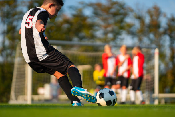 istock real soccer game situation junior player during free kick 1134877547