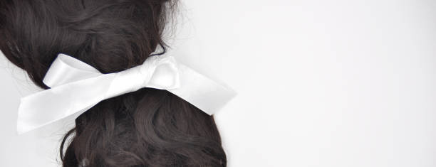 istock Dark brown curly hair with white lace on the white background 1134878767