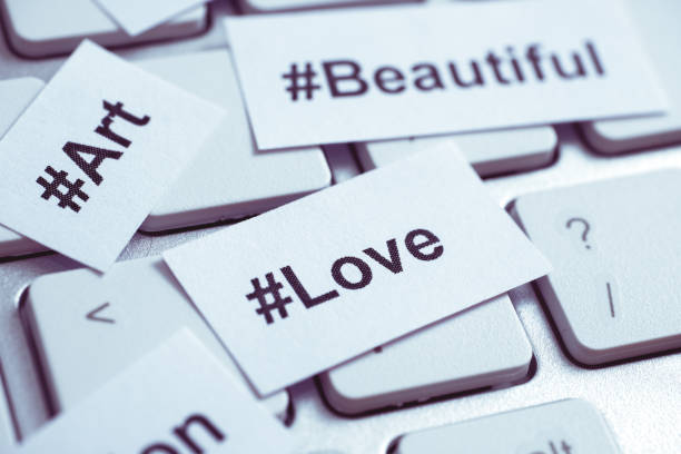 istock Popular hashtags printed on paper and on the keyboard. Close up. Toned. 1134878837