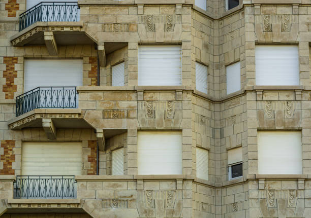istock modern apartment complex in vintage style, balconies with closed roller shutters, Beautiful belgian architecture 1134880731