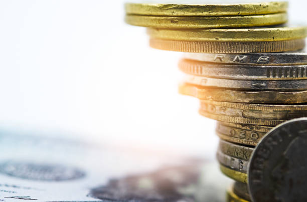 istock Closeup of gold and silver coins stacking in each different position on white background - Image. 1134880773