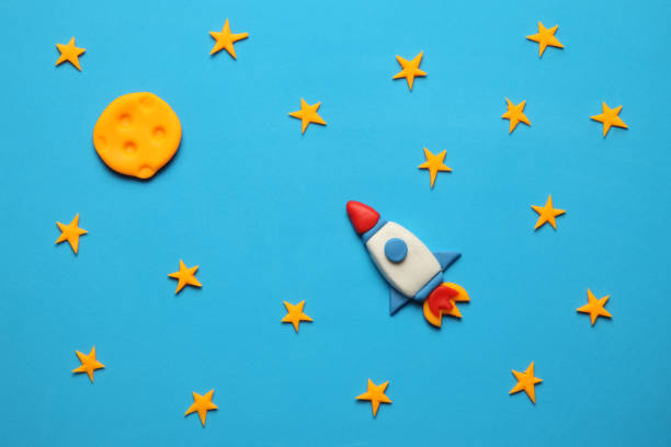 istock Rocket in space, star, and moon. Plasticine art, cartoon 1134880860