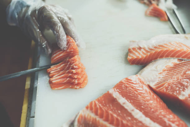 istock Asian chef slice japanese food sashimi salmon 1134883027