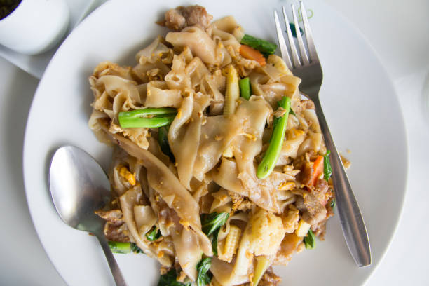 istock Stir fry noodles  in white bowl. 1134883682