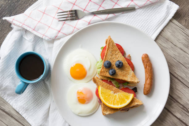 istock Sandwich with ham and tomatoes on plate 1134883708
