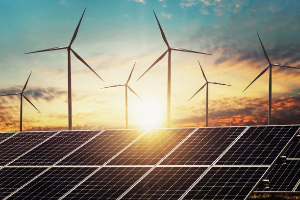 istock clean energy power concept solar panel with wind turbine and sunset background 1134884088