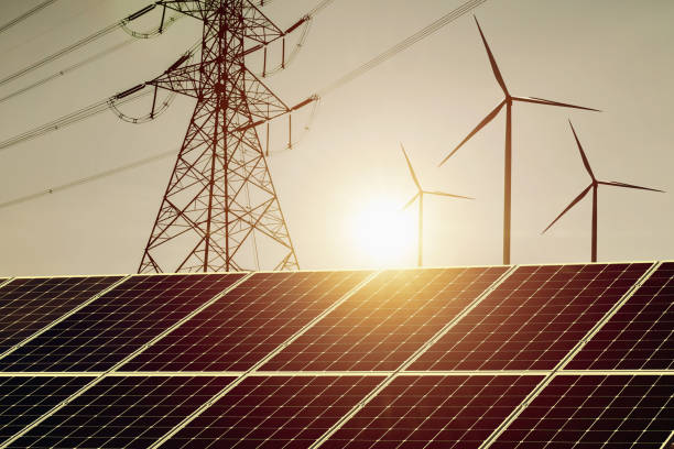 istock clean energy power concept solar panel with wind turbine and hight voltage electric tower 1134884089