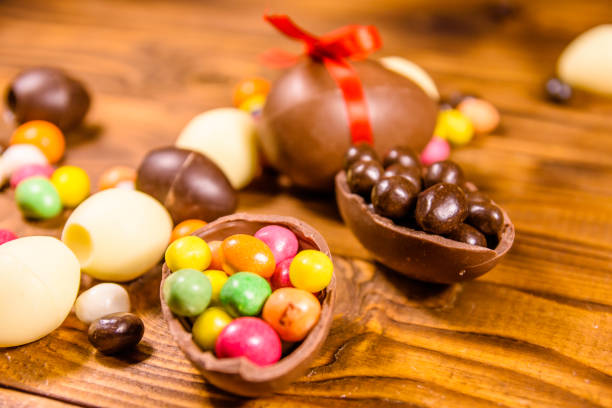 istock Chocolate easter eggs and multicolored candies on wooden table 1134884889