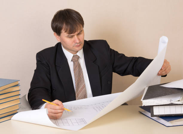 istock Engineer working with drawing at the table in the office 1134885087