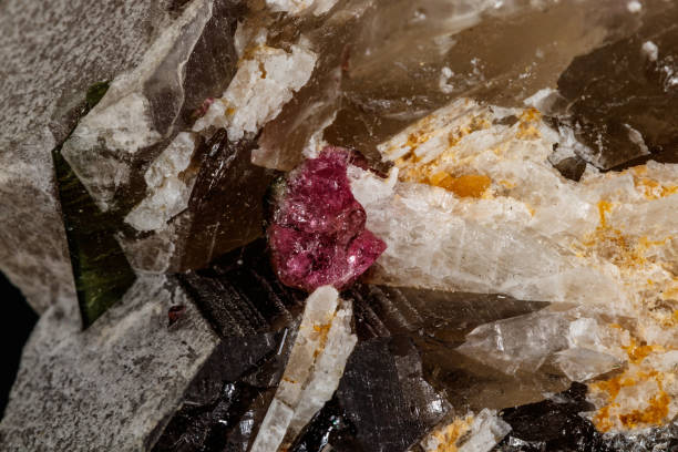 istock Macro mineral quartz mineral Tourmaline on Lepidolite black background 1134885396