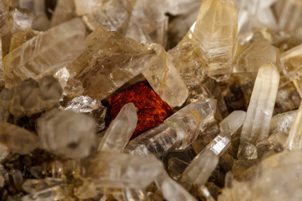 istock Macro mineral quartz stone with Limonite and Lepidolite black background 1134885646