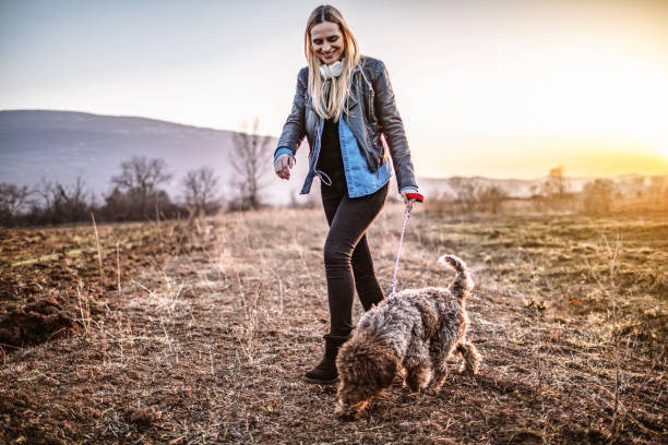 istock Woman walking with dog 1134886740