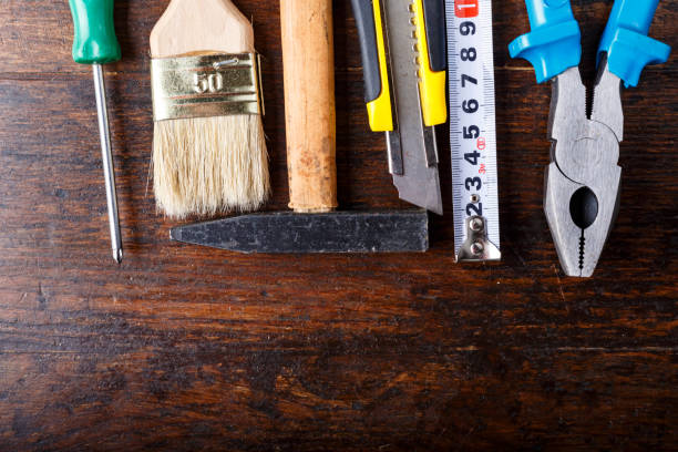 istock work tool set. on a brown wooden table. view from above. 1134888820