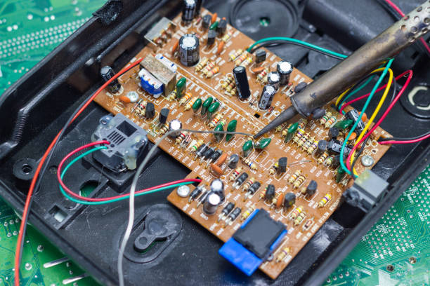 istock Technician repairing electronic of the computer's circuit board by soldering Irons 1134889272